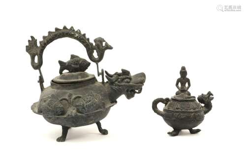 two oriental metal teapots…