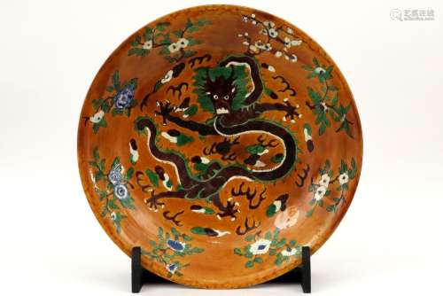 large Chinese dish in marked ceramic with a polych…
