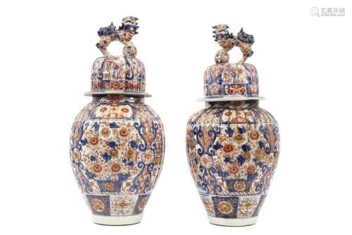 pair of antique Japanese lidded vases in porcelain…