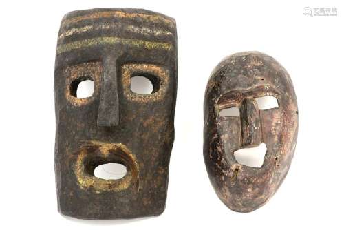 two Nepalese wooden masks…
