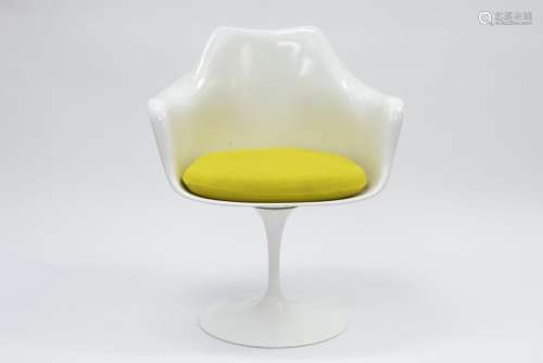 white design chair on rotating foor with a yellow …