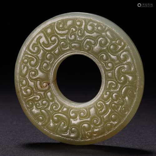 a round flat piece of jade from  the Qing Dynasty