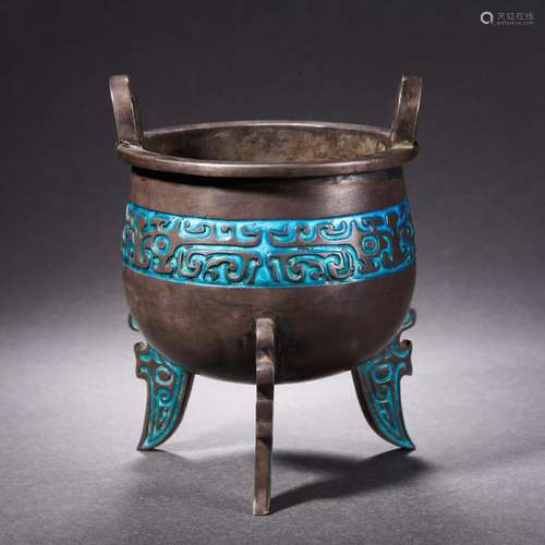 A three-legged silver stove burning blue from the Ming dynas...