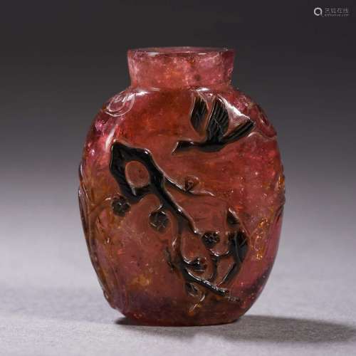Tourmaline flower and bird snuff bottle from the Qing Dynast...