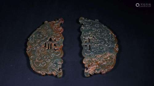 A PAIR OF CARVED JADE PENDANTS .BI.HAN DYNASTY