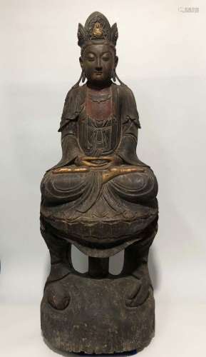 A WOOD CARVING OF SEATED GUANYIN