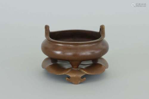 A BRONZE TRIPOD CENSER AND STAND .MARK OF XUANDE