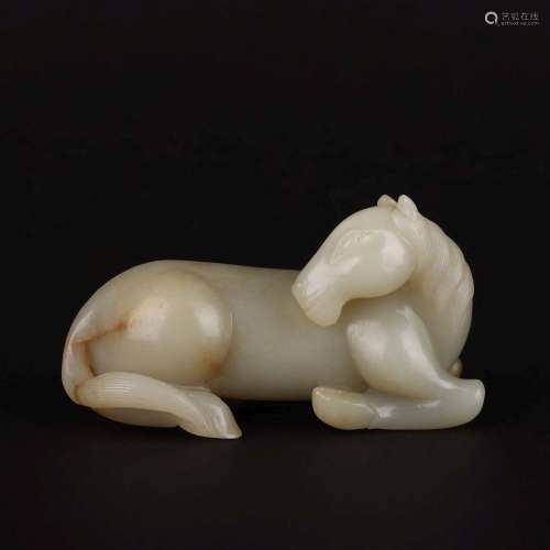 A CARVED WHITE JADE HORSE.HAN DYNASTY