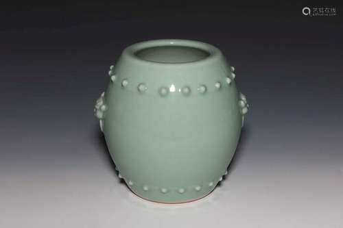 A CELADON-GLAZED JAR.MARK OF QIANLONG