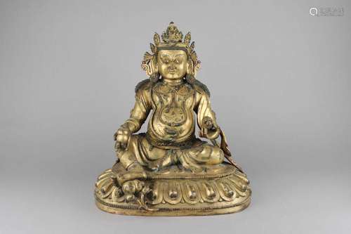 A GILT-BRONZE FIGURE OF YELLOW JAMBHALA.QING DYNASTY