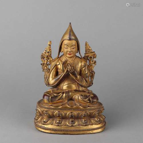 A GILT-BRONZE FIGURE OF GURU.QING DYNASTY