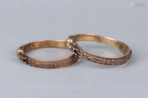 A PAIR OF GILT-SILVER'DRAGON' BANGLES.QING DYNASTY