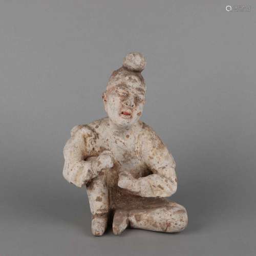 A PAINTED POTTERY SEATED FIGURE .TANG DYNASTY