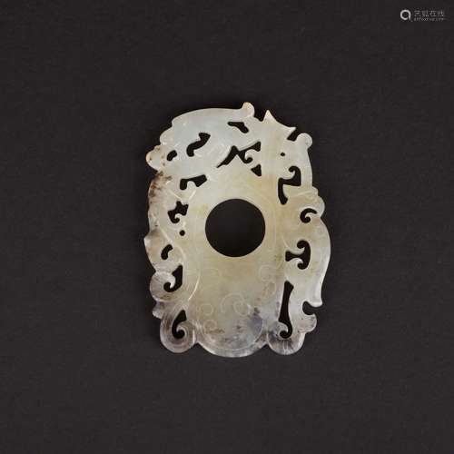 A CARVED WHITE JADE 'DRAGON' PENDANT.WARRING STATES PERIOD