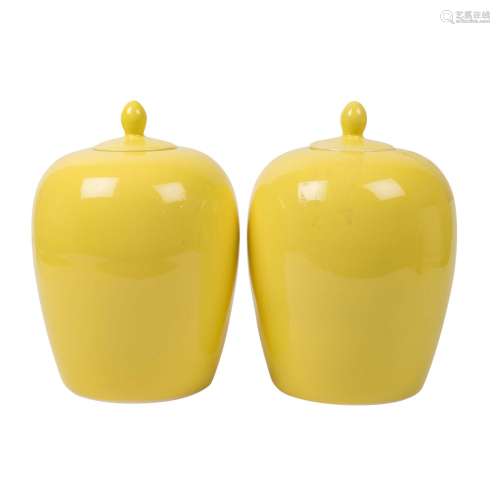 Pair of lemon yellow glazed lidded vessels. CHINA