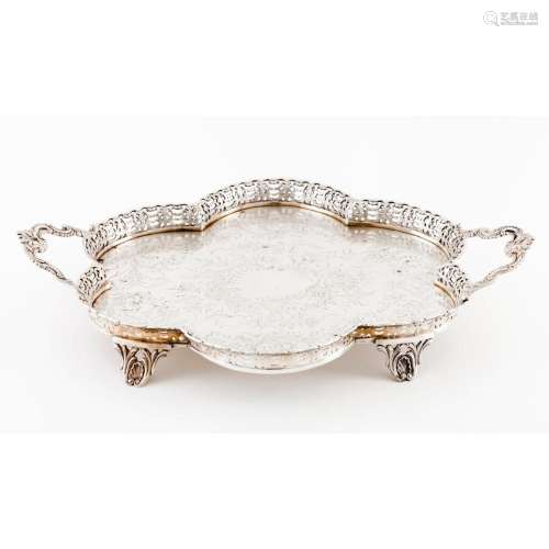 A scalloped and galleried four footed tray