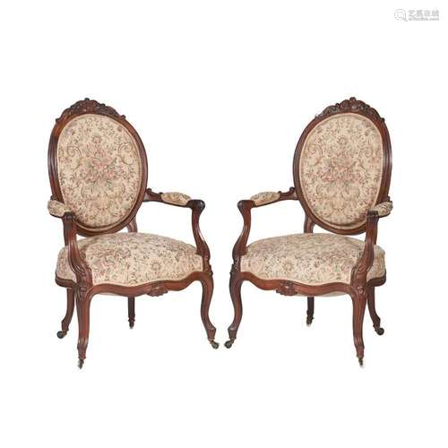 A pair of Louis XV/XVI style fauteuils