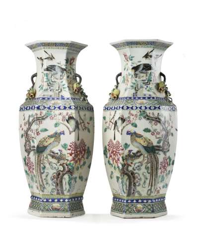 A pair of polychrome Famille Rose porcelain vases decorated ...
