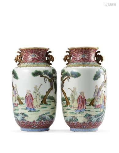 A pair of rouleau Famille Rose vases with landscape and figu...