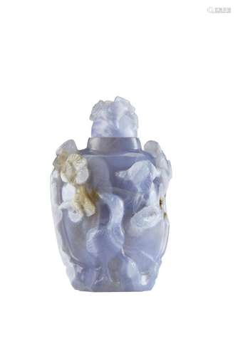 A carved blue agate snuff bottle with plants and animal moti...