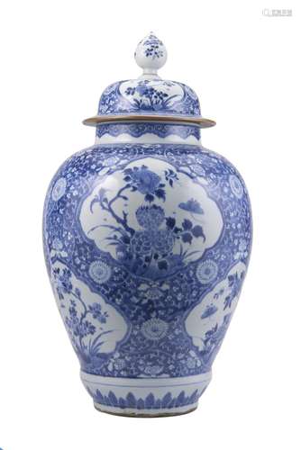 A large blue and white balauster vase with cover