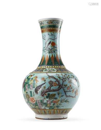 A turquoise ground porcelain bottle vase with flowers