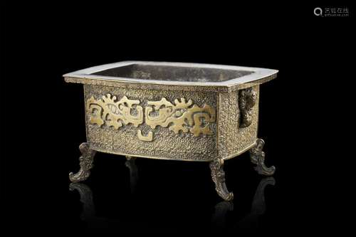 A bronze censer decorated with a relief stylized taotie figu...