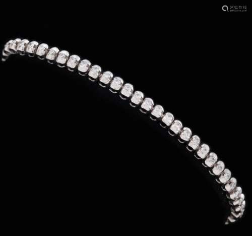 RIVIERE STYLE BRACELET WITH DIAMONDS IN 18 KT GOLD_.<br />
B...