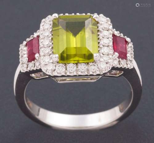 RING WITH CENTRAL PERIDOT ACCOMPANIED BY TWO RUBIES AND DIAM...