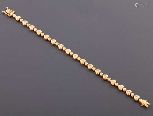 HEART-SHAPED BRACELET WITH DIAMONDS IN 18 KT GOLD _<br />
ri...