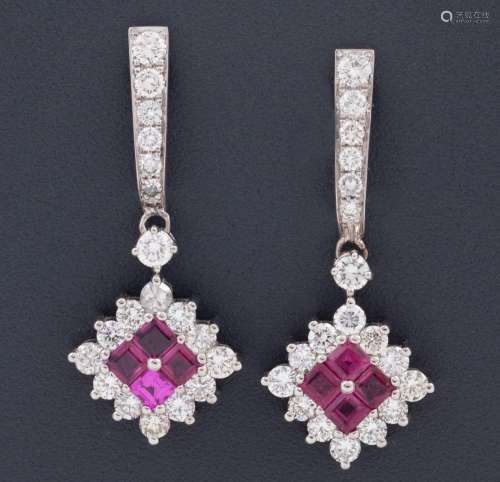 PAIR OF DIAMOND AND RUBY EARRINGS_.<br />
Pair of 18kt gold ...