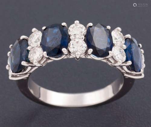 RING WITH SAPPHIRES AND DIAMONDS IN 18 KT GOLD_.<br />
Ring ...