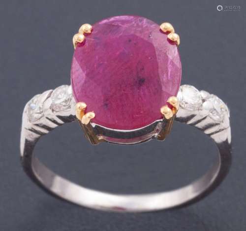 RING WITH CENTRAL RUBY ACCOMPANIED BY TWO DIAMONDS ON EACH S...