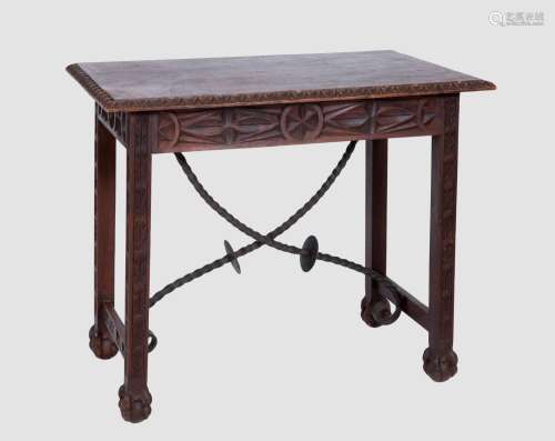 CASTILIAN WALNUT TABLE WITH CARVED DECORATION AND IRON FASTE...