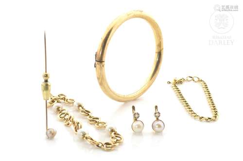 Set of pieces in 18k yellow gold