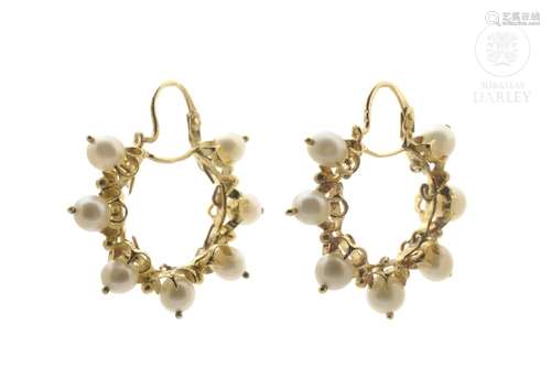 Earrings in 18k yellow gold and pearls