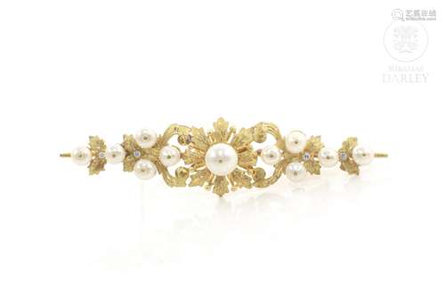 Elongated brooch in 18k yellow gold, pearls and zircons