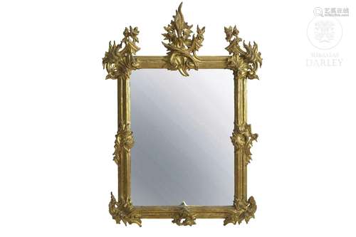 Carved and gilded wooden mirror, 19th century