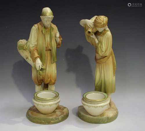 A large pair of Royal Worcester Eastern Water Carrier figure...