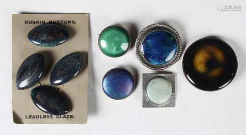 A set of four Ruskin marquise shaped pottery buttons on thei...