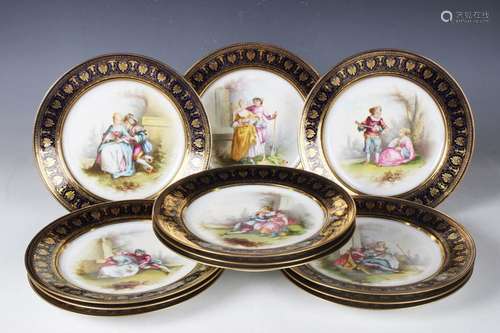 A cased set of twelve Sèvres style French porcelain plates