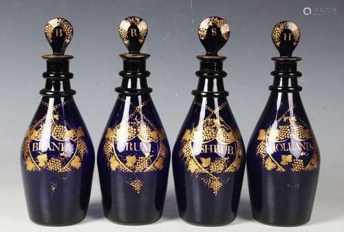 A good set of four Bristol blue mallet shaped decanters and ...