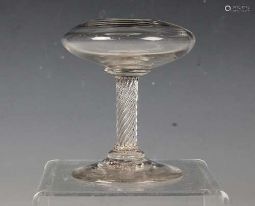 A small glass oil lamp