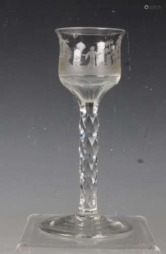 A chinoiserie wine glass with faceted stem