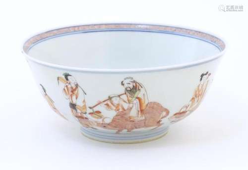 A Chinese bowl decorated with figures and animals to include...