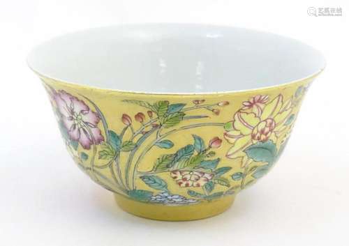 A Chinese famille rose small bowl with a gilt ground decorat...