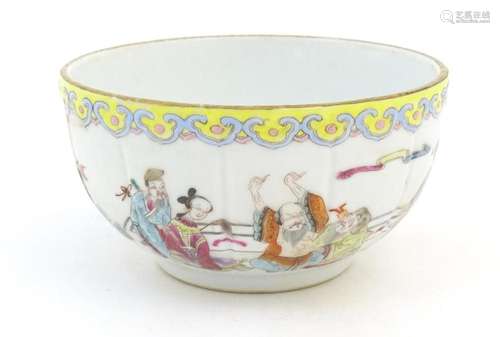 A Chinese famille rose bowl decorated with figures in a styl...