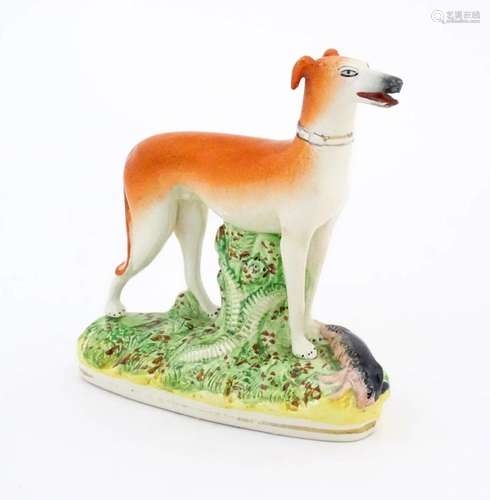 A 19thC flatback Staffordshire pottery model of a greyhound ...