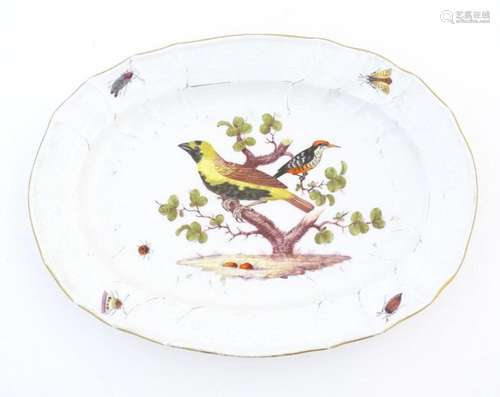 A Meissen style plate of oval form with bird decoration to c...