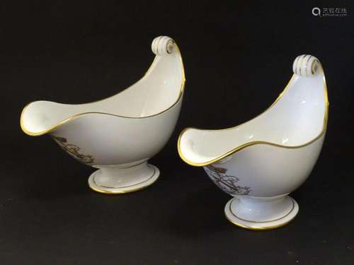 A pair of large French Dore a Sevres sauce boats with scroll...